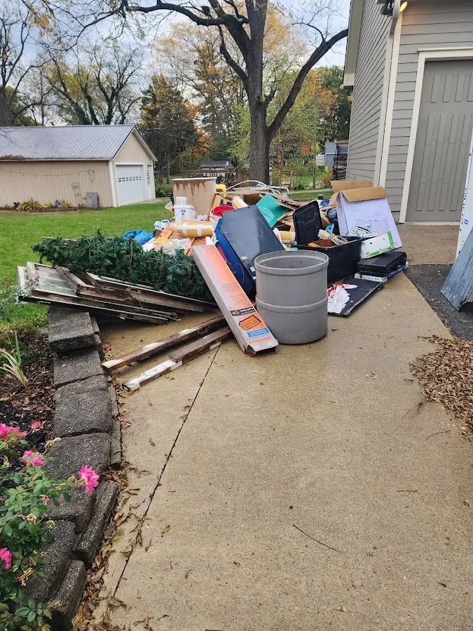 Dumpster being loaded with debris for 3 Yard Dumpster Rental in Fallsburg